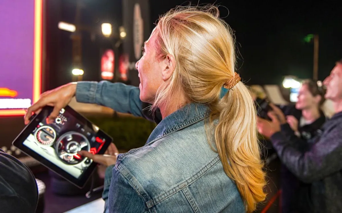 Guest customizes a MINI dashboard using a handheld touchscreen