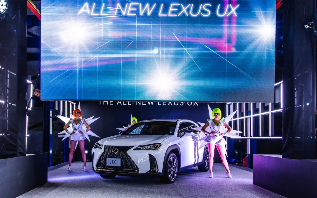 Lexus UX on stage with futuristic costumed performers