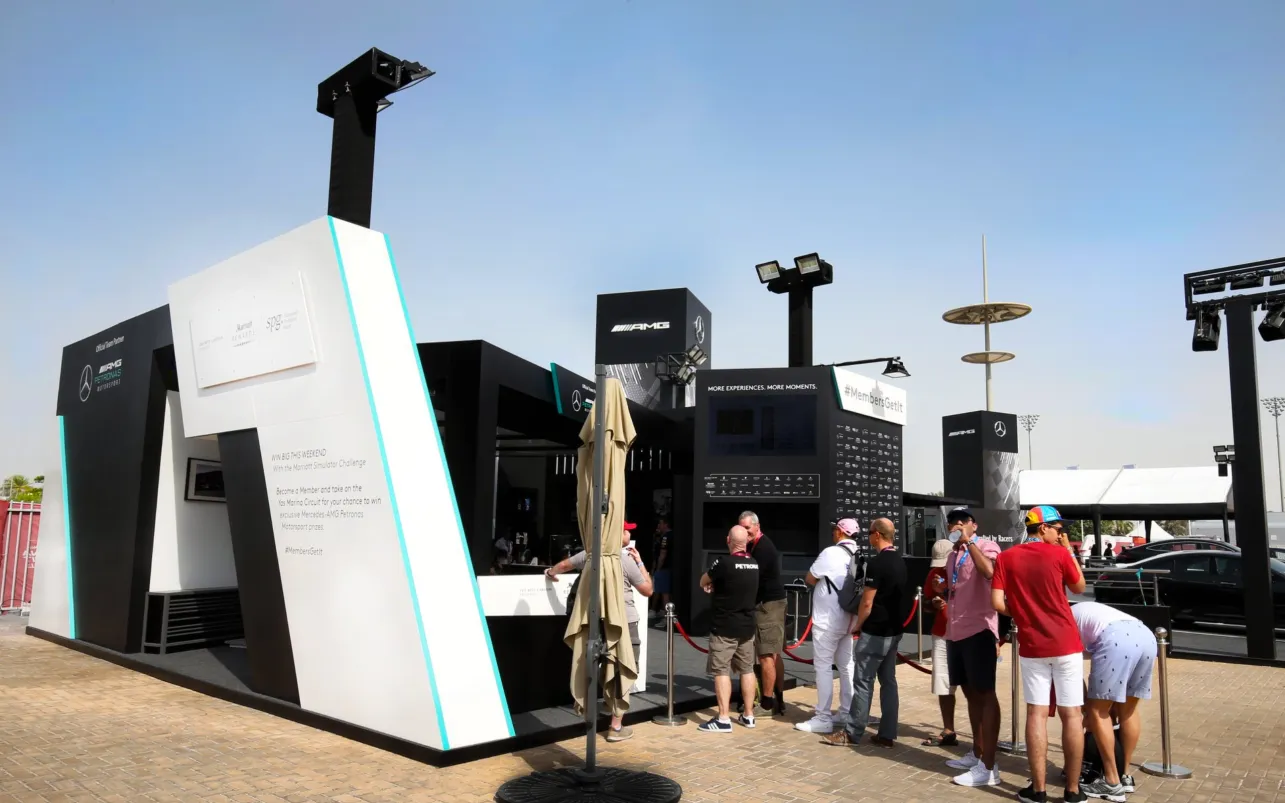 Guests gather around the angular Mercedes-AMG activation booth