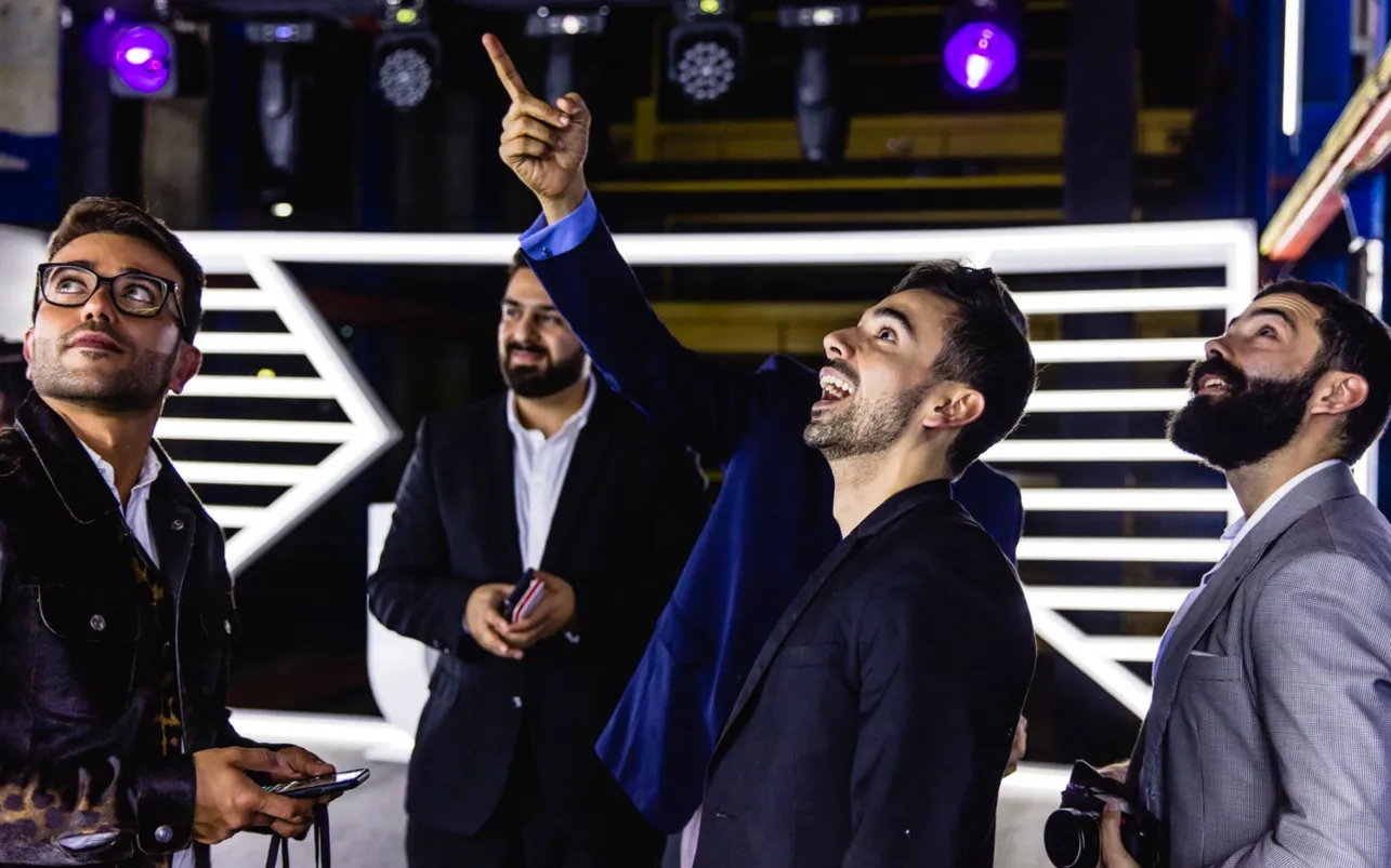 Guests laugh and point during the Lexus vehicle launch
