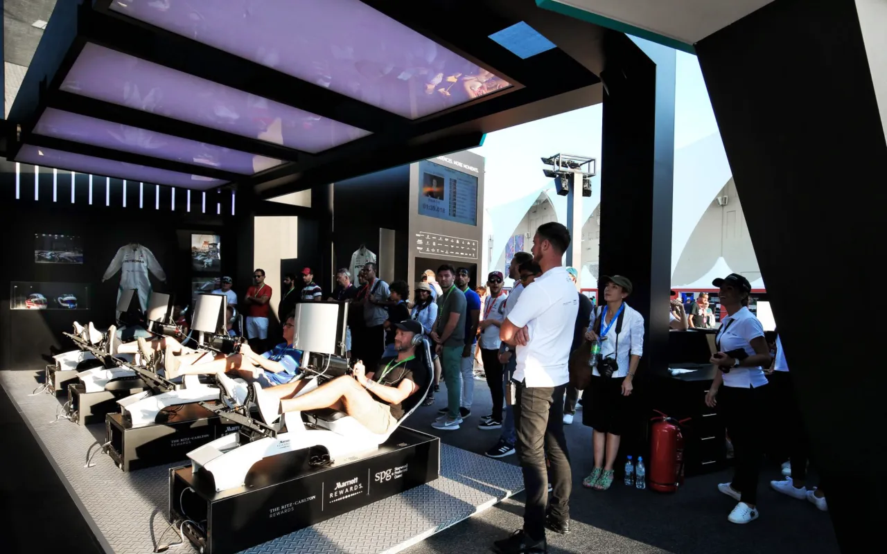 Guests use Formula One racing simulators inside the Marriott Garage