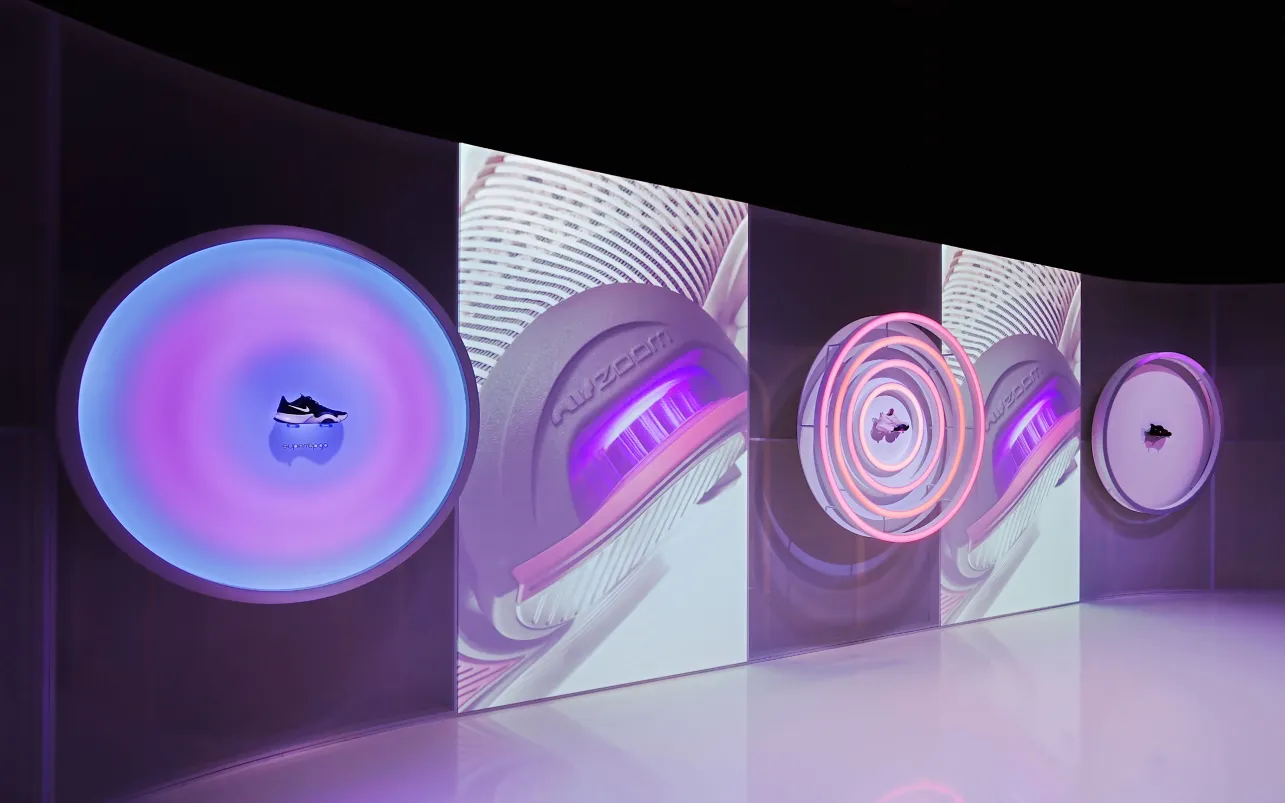 Nike shoe displayed inside a circular neon wall installation