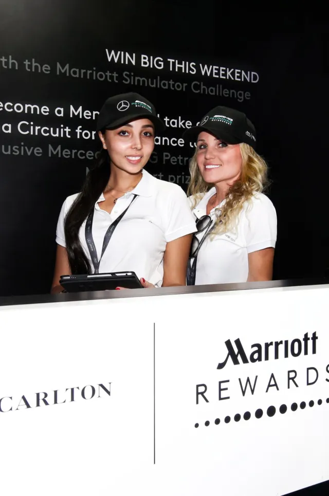 Two hostesses welcome guests at the Marriott Rewards registration counter